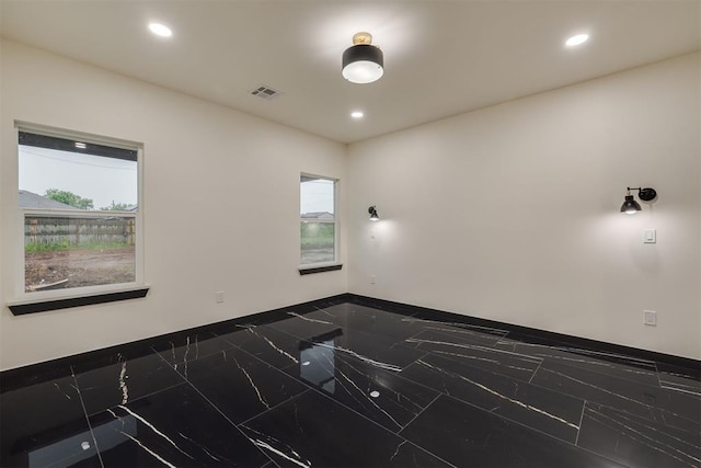 528 NW 112th St, Oklahoma City, OK 73114 - unfurnished room with marble tiled floors, recessed lighting, and baseboards