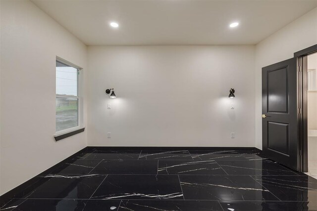 528 NW 112th St, Oklahoma City, OK 73114 - unfurnished room with marble tiled floors, recessed lighting, and baseboards
