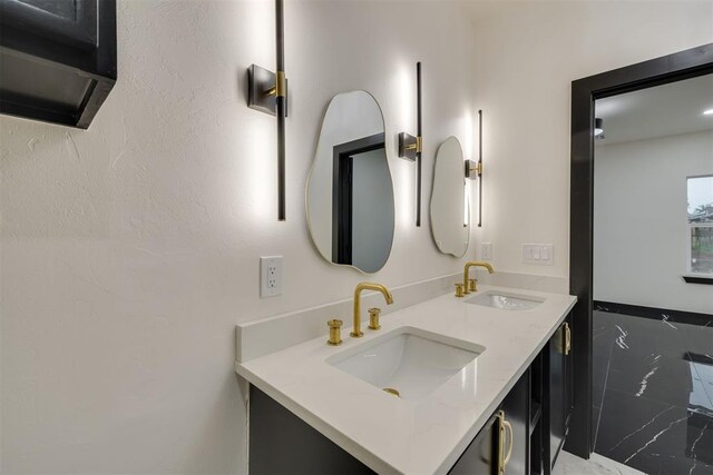 528 NW 112th St, Oklahoma City, OK 73114 - bathroom with marble finish floors and double vanity