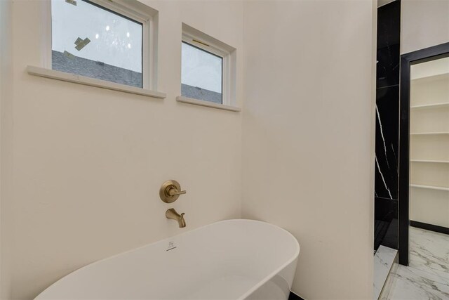 528 NW 112th St, Oklahoma City, OK 73114 - bathroom with marble finish floors and a freestanding tub