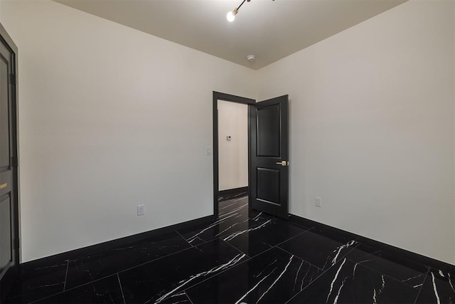 528 NW 112th St, Oklahoma City, OK 73114 - empty room with dark marble finish flooring and baseboards