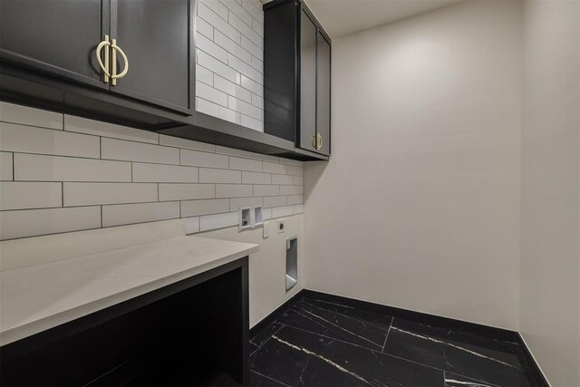 528 NW 112th St, Oklahoma City, OK 73114 - laundry room featuring marble finish flooring, cabinet space, baseboards, electric dryer hookup, and washer hookup