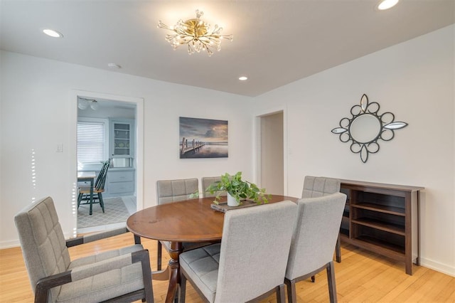 dining space featuring recessed lighting, light wood finished floors, and baseboards