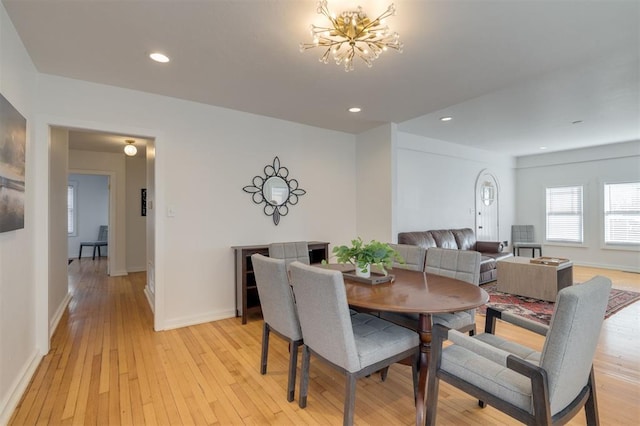dining space featuring recessed lighting, a notable chandelier, and light wood-type flooring