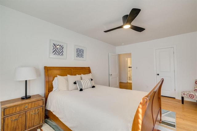 bedroom with light wood-style floors and ceiling fan