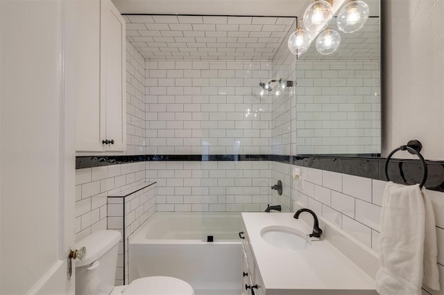 bathroom featuring tile walls, toilet, a chandelier, shower / bath combination, and vanity