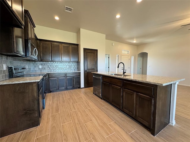 kitchen with visible vents, a sink, dishwashing machine, stainless steel microwave, and black range with electric stovetop