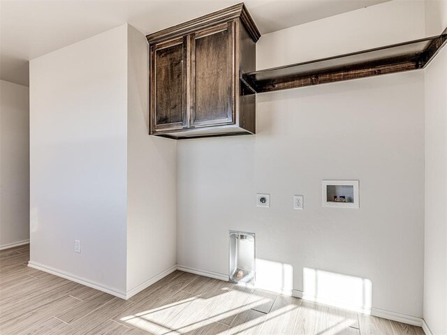laundry area with hookup for an electric dryer, light wood-type flooring, baseboards, and hookup for a washing machine