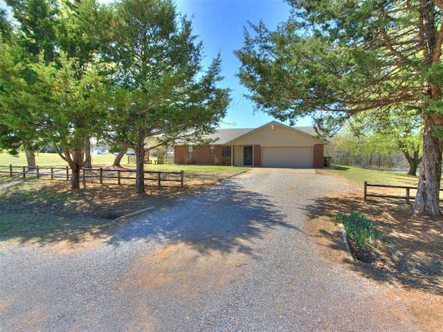 2 James Ray Rd, Shawnee, OK 74801 - ranch-style home featuring driveway, fence, brick siding, and an attached garage