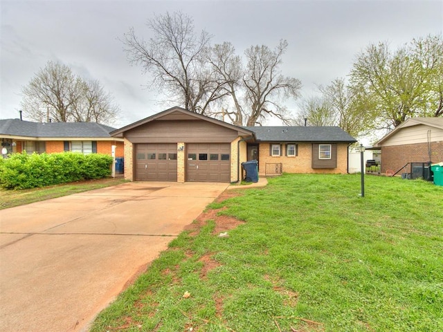 single story home featuring a front yard, driveway, brick siding, and a garage