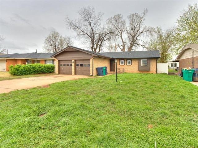 ranch-style home featuring an attached garage, driveway, a front lawn, and brick siding