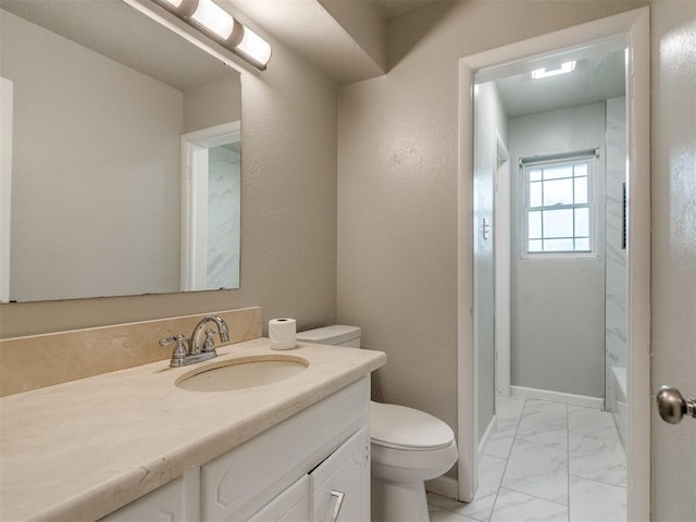 bathroom featuring vanity, a bathing tub, walk in shower, toilet, and marble finish floor