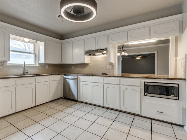 kitchen with under cabinet range hood, a sink, backsplash, and appliances with stainless steel finishes