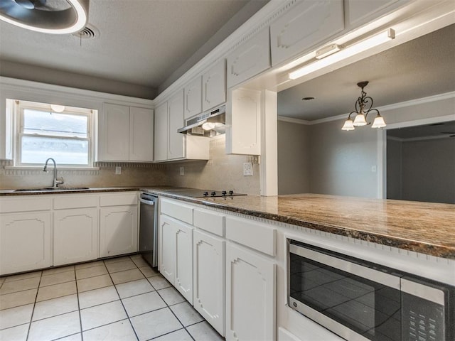 kitchen featuring stainless steel microwave, white cabinetry, under cabinet range hood, black electric cooktop, and a sink