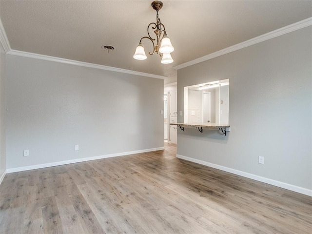 interior space featuring a chandelier, baseboards, visible vents, and light wood-style flooring