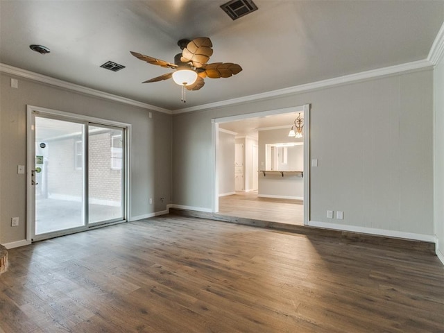 spare room with visible vents, ceiling fan with notable chandelier, and wood finished floors