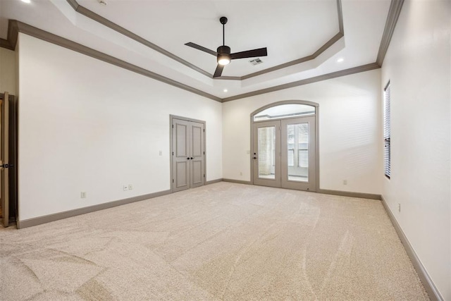 13125 Oakcliff Rd, Oklahoma City, OK 73120 - unfurnished room featuring light carpet, ceiling fan, visible vents, and a raised ceiling