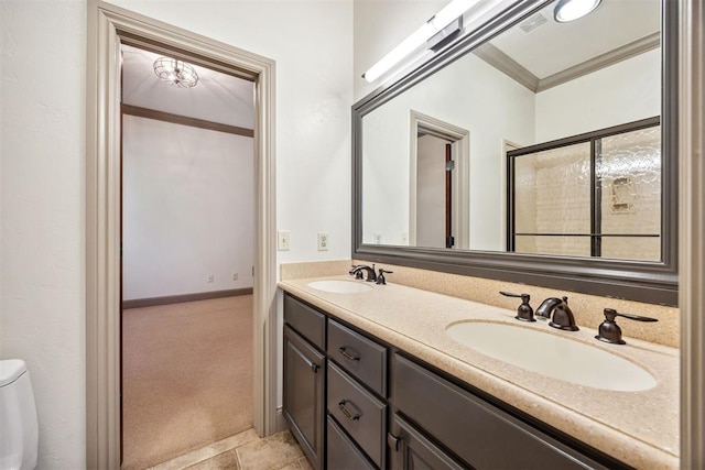 13125 Oakcliff Rd, Oklahoma City, OK 73120 - full bathroom featuring double vanity, a sink, ornamental molding, and baseboards