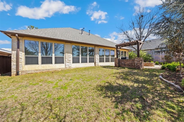 13125 Oakcliff Rd, Oklahoma City, OK 73120 - back of house with a shingled roof, a pergola, stone siding, a lawn, and fence
