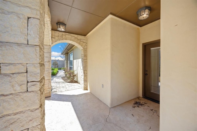 13125 Oakcliff Rd, Oklahoma City, OK 73120 - view of exterior entry with stone siding and stucco siding