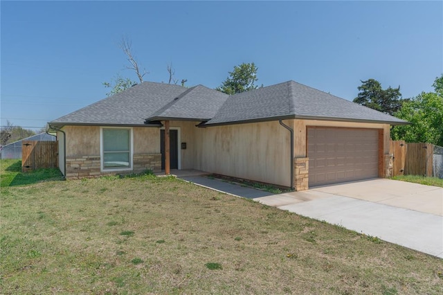 1800 N Nebraska Ave, Oklahoma City, OK 73111 - ranch-style home with an attached garage, a shingled roof, fence, and stone siding
