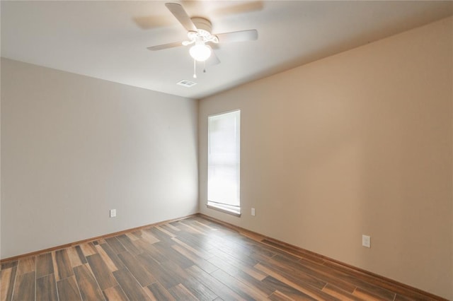 1800 N Nebraska Ave, Oklahoma City, OK 73111 - spare room with visible vents, ceiling fan, wood finished floors, and baseboards