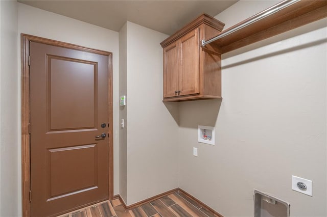 1800 N Nebraska Ave, Oklahoma City, OK 73111 - clothes washing area featuring baseboards, electric dryer hookup, washer hookup, cabinet space, and wood finished floors