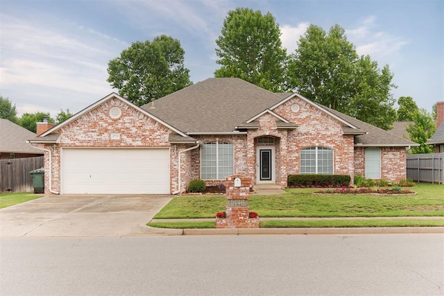 2713 Jills Trl, Edmond, OK 73012 - traditional-style house with an attached garage, brick siding, concrete driveway, and a shingled roof