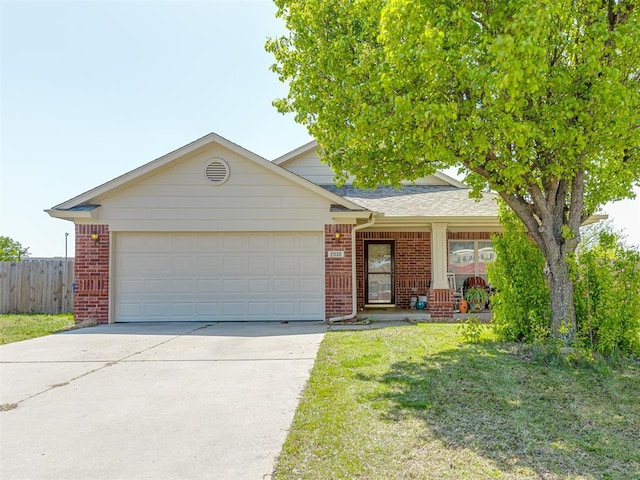 ranch-style house featuring fence, a front lawn, brick siding, an attached garage, and driveway