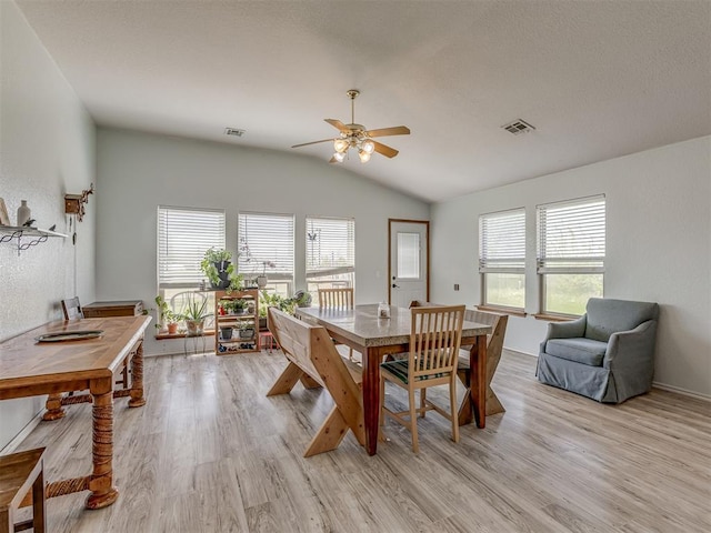 dining space with visible vents, ceiling fan, and light wood finished floors