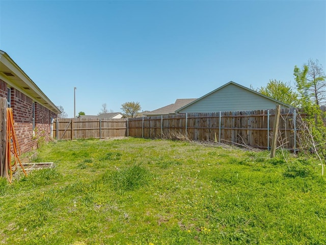 view of yard featuring a fenced backyard