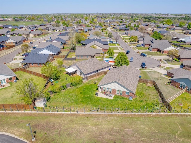birds eye view of property with a residential view