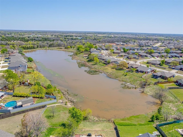 bird's eye view featuring a water view and a residential view