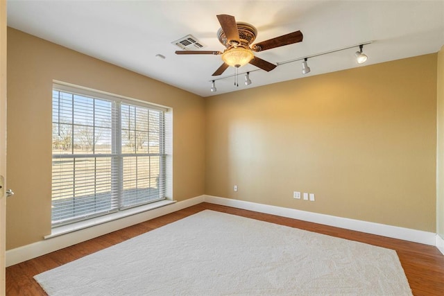 17787 N County Road 3200th Rd, Pauls Valley, OK 73075 - unfurnished room featuring visible vents, ceiling fan, baseboards, and wood finished floors