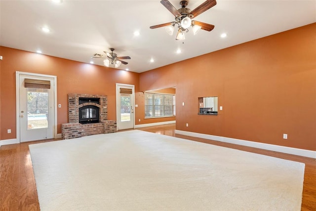 17787 N County Road 3200th Rd, Pauls Valley, OK 73075 - unfurnished living room with light wood finished floors, ceiling fan, recessed lighting, and a fireplace