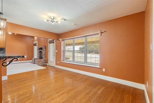 17787 N County Road 3200th Rd, Pauls Valley, OK 73075 - unfurnished living room with light wood finished floors, visible vents, and baseboards