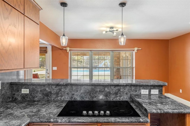 17787 N County Road 3200th Rd, Pauls Valley, OK 73075 - kitchen featuring decorative light fixtures, dark stone counters, and black electric cooktop