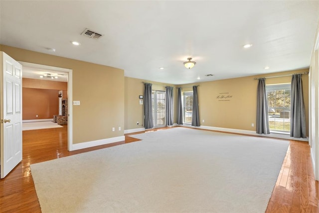 17787 N County Road 3200th Rd, Pauls Valley, OK 73075 - unfurnished living room with visible vents, baseboards, recessed lighting, and wood finished floors