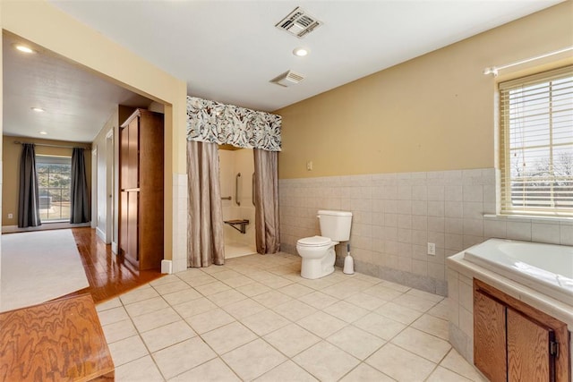 17787 N County Road 3200th Rd, Pauls Valley, OK 73075 - full bath with tile patterned flooring, visible vents, tile walls, and toilet
