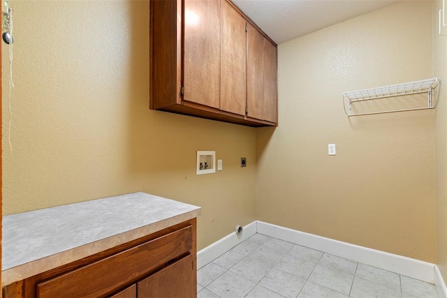 17787 N County Road 3200th Rd, Pauls Valley, OK 73075 - laundry area featuring light tile patterned floors, baseboards, washer hookup, hookup for an electric dryer, and cabinet space