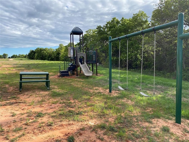 community jungle gym featuring a lawn