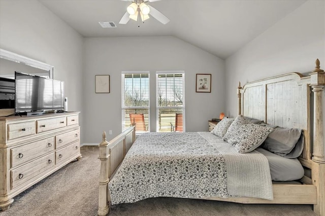 carpeted bedroom featuring vaulted ceiling, visible vents, and ceiling fan