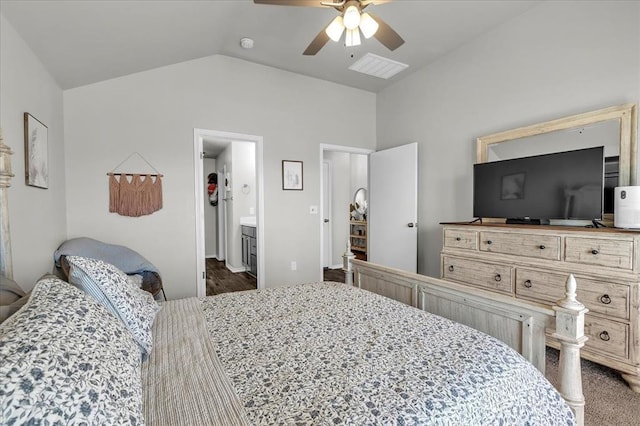 bedroom featuring lofted ceiling, visible vents, a ceiling fan, and connected bathroom