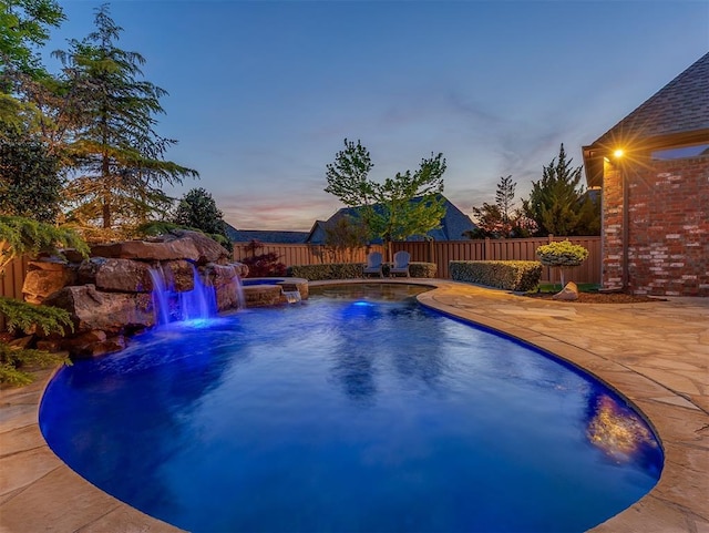 view of swimming pool featuring a fenced in pool, a fenced backyard, and a patio area