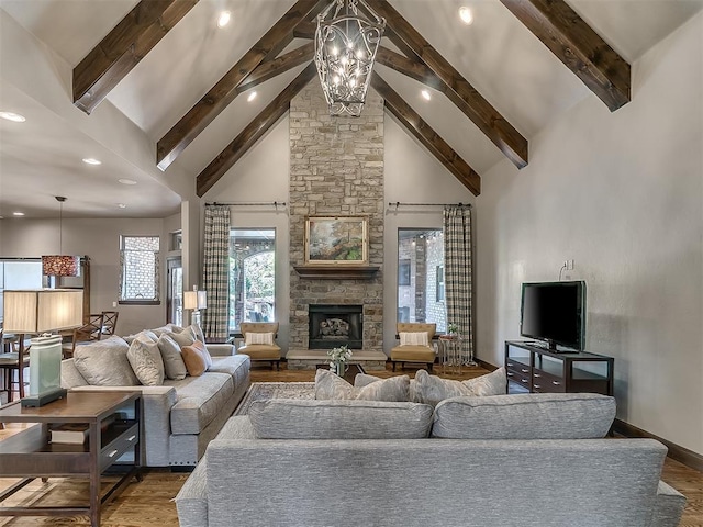 living room with recessed lighting, wood finished floors, and beam ceiling