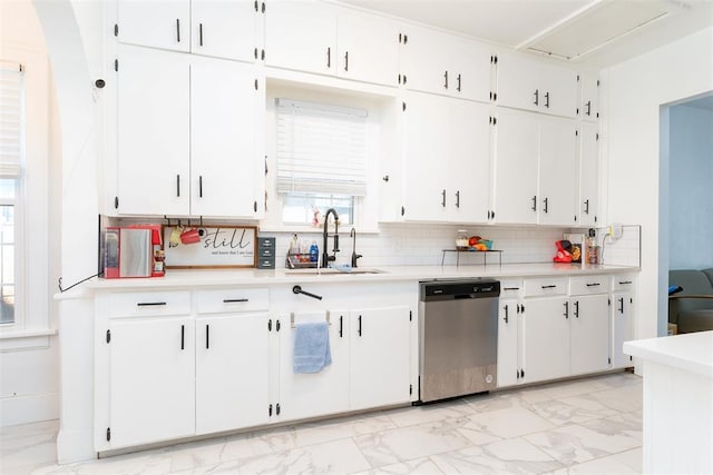 1428 NW 45th St, Oklahoma City, OK 73118 - kitchen featuring light countertops, marble finish floor, stainless steel dishwasher, and a sink