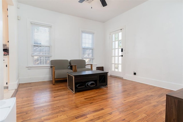 1428 NW 45th St, Oklahoma City, OK 73118 - living area featuring light wood-type flooring, a ceiling fan, and baseboards