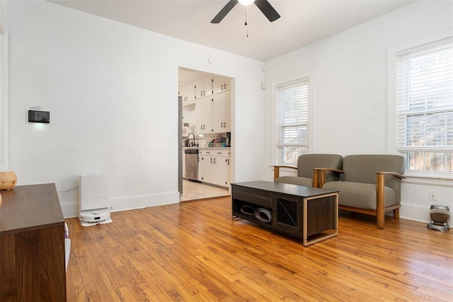 1428 NW 45th St, Oklahoma City, OK 73118 - sitting room with a ceiling fan, baseboards, and light wood-style floors