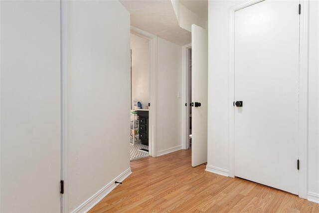 1428 NW 45th St, Oklahoma City, OK 73118 - hallway with baseboards and light wood-type flooring