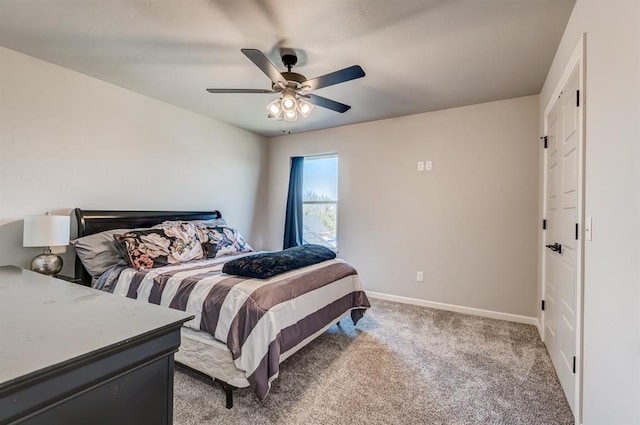 1219 N Adair Ct, Stillwater, OK 74075 - bedroom with light colored carpet, baseboards, and a ceiling fan